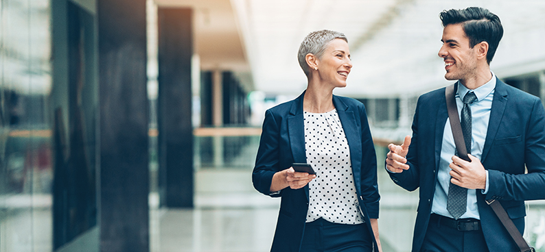 Business man and woman walking